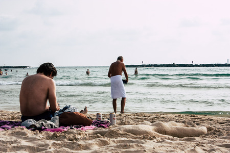 Tel Aviv Israel June 8, 2019 View of unknown Israeli people having fun on the beach of Tel Aviv in the afternoonのeditorial素材