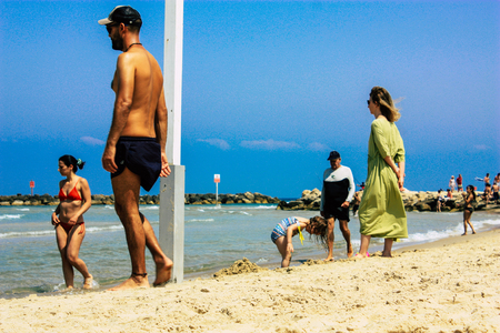 Tel Aviv Israel June 9, 2019 View of unknown Israeli people having fun on the beach of Tel Aviv in the afternoonのeditorial素材