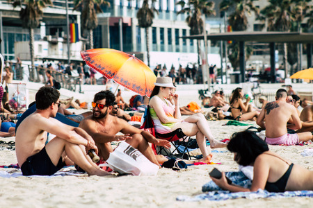 Tel Aviv Israel June 8, 2019 View of unknown Israeli people having fun on the beach of Tel Aviv in the afternoonのeditorial素材