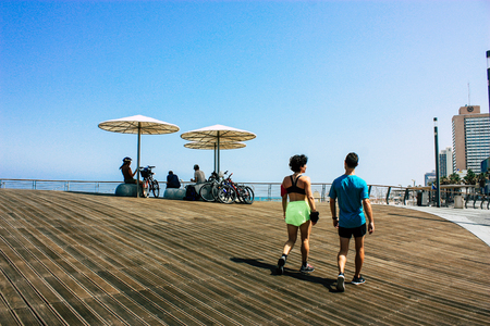 Tel Aviv Israel June 9, 2019 View of unknown Israeli people having fun on the beach of Tel Aviv in the afternoonのeditorial素材