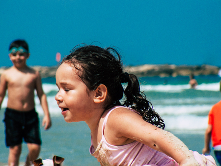 Tel Aviv Israel June 2, 2019 View of unknown Israeli children having fun on the beach of Tel Aviv in the afternoonのeditorial素材