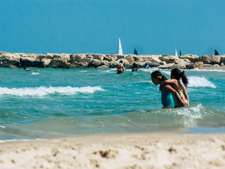 Tel Aviv Israel June 2, 2019 View of unknown Israeli children having fun on the beach of Tel Aviv in the afternoonのeditorial素材