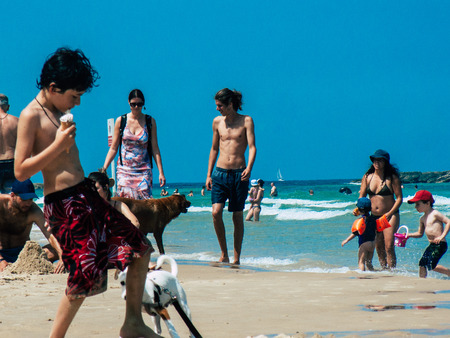 Tel Aviv Israel June 2, 2019 View of unknown Israeli children having fun on the beach of Tel Aviv in the afternoonのeditorial素材