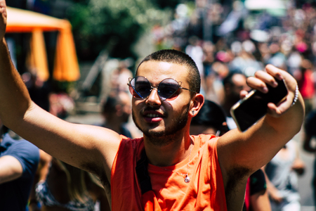 Tel Aviv Israel June 14, 2019 Portrait of unknown Israeli people participating to the gay pride parade in the streets of Tel Aviv in the afternoonのeditorial素材