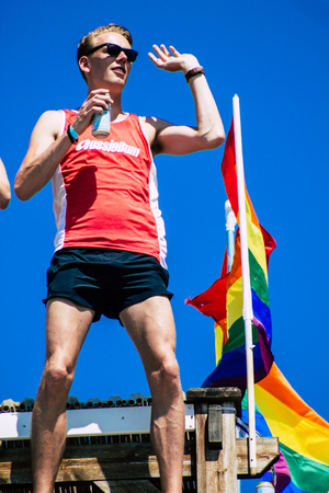 Tel Aviv Israel June 14, 2019 View of unknown Israeli people watching the gay pride parade of Tel Aviv from the balcony in the afternoonのeditorial素材