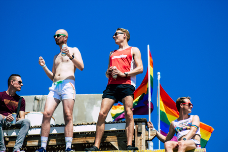 Tel Aviv Israel June 14, 2019 View of unknown Israeli people watching the gay pride parade of Tel Aviv from the balcony in the afternoonのeditorial素材