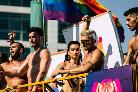 Tel Aviv Israel June 14, 2019 View of unknown Israeli people watching the gay pride parade of Tel Aviv from the balcony in the afternoonのeditorial素材