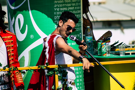 Tel Aviv Israel June 14, 2019 View of unknown Israeli people watching the gay pride parade of Tel Aviv from the balcony in the afternoonのeditorial素材
