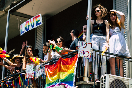 Tel Aviv Israel June 14, 2019 View of unknown Israeli people watching the gay pride parade of Tel Aviv from the balcony in the afternoonのeditorial素材