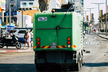 Tel Aviv Israel June 14, 2019 View of a green garbage truck rolling in the streets of Tel Aviv in the afternoonのeditorial素材