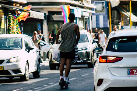 Tel Aviv Israel June 15, 2019 View of unknown Israeli people rolling with a electric scooter in the streets of Tel Aviv in the afternoonのeditorial素材