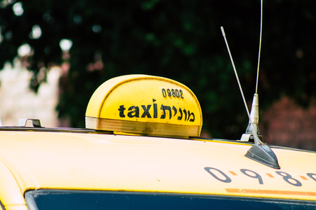 Tel Aviv Israel June 16, 2019 View of traditional taxi rolling in the streets of Tel Aviv in the afternoonのeditorial素材