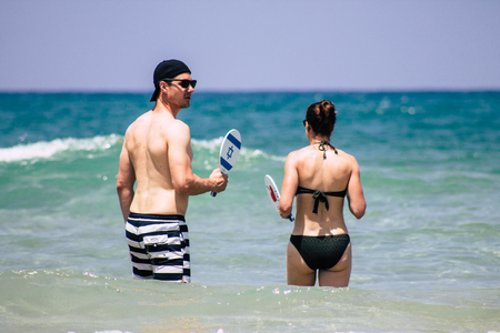 Tel Aviv Israel June 15, 2019 View of unknown Israeli people having fun on the beach of Tel Aviv in the afternoonのeditorial素材