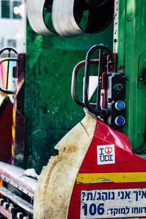 Tel Aviv Israel June 14, 2019 View of a green garbage truck rolling in the streets of Tel Aviv in...