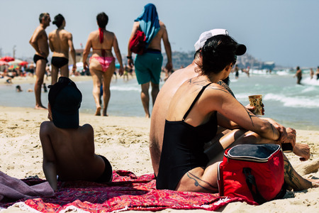 Tel Aviv Israel June 15, 2019 View of unknown Israeli people having fun on the beach of Tel Aviv in the afternoonのeditorial素材