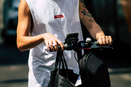 Tel Aviv Israel June 15, 2019 View of unknown Israeli people rolling with a electric scooter in the streets of Tel Aviv in the afternoonのeditorial素材