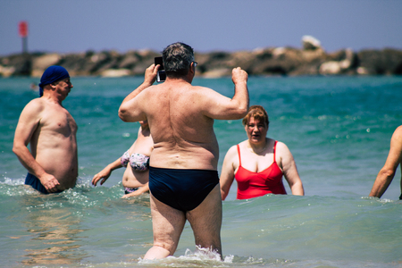 Tel Aviv Israel June 15, 2019 View of unknown Israeli people having fun on the beach of Tel Aviv in the afternoonのeditorial素材