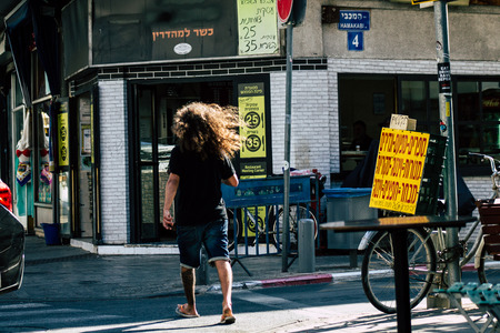 Tel Aviv Israel June 16, 2019 View of unknown Israeli people walking in the streets of Tel Aviv in the afternoonのeditorial素材