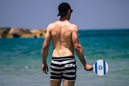 Tel Aviv Israel June 15, 2019 View of unknown Israeli people having fun on the beach of Tel Aviv in the afternoonのeditorial素材
