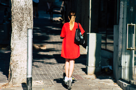 Tel Aviv Israel June 17, 2019 View of unknown Israeli people rolling with a electric scooter in the streets of Tel Aviv in the afternoonのeditorial素材