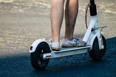 Tel Aviv Israel June 17, 2019 View of unknown Israeli people rolling with a electric scooter in the streets of Tel Aviv in the afternoonのeditorial素材