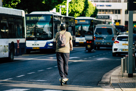 Tel Aviv Israel June 17, 2019 View of unknown Israeli people rolling with a electric scooter in the streets of Tel Aviv in the afternoonのeditorial素材