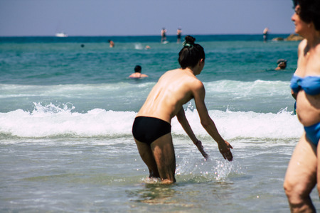 Tel Aviv Israel June 15, 2019 View of unknown Israeli people having fun on the beach of Tel Aviv in the afternoonのeditorial素材