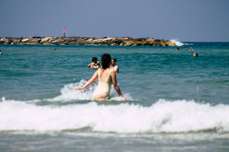 Tel Aviv Israel June 15, 2019 View of unknown Israeli people having fun on the beach of Tel Aviv in the afternoonのeditorial素材