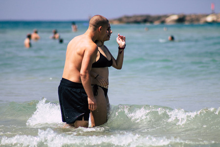 Tel Aviv Israel June 15, 2019 View of unknown Israeli people having fun on the beach of Tel Aviv in the afternoonのeditorial素材