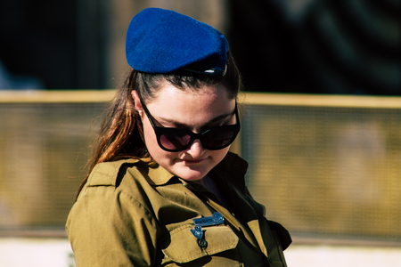 Jerusalem Israel June 19, 2019 View of young Israeli woman soldier having fun front the Western wall at the Old city of Jerusalem in the afternoonのeditorial素材