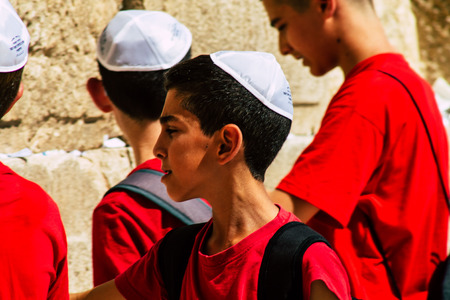Jerusalem Israel June 19, 2019 View of young Israeli kid praying at the Western wall in the Old city of Jerusalem in the afternoonのeditorial素材