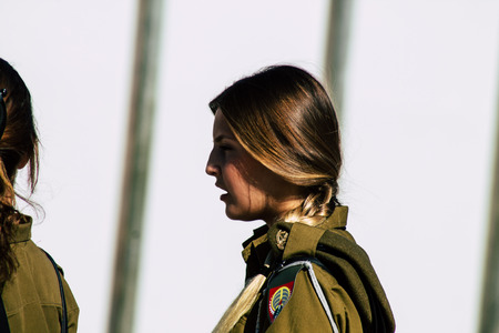 Jerusalem Israel June 19, 2019 View of young Israeli woman soldier having fun front the Western wall at the Old city of Jerusalem in the afternoonのeditorial素材