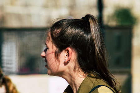 Jerusalem Israel June 19, 2019 View of young Israeli woman soldier having fun front the Western wall at the Old city of Jerusalem in the afternoonのeditorial素材