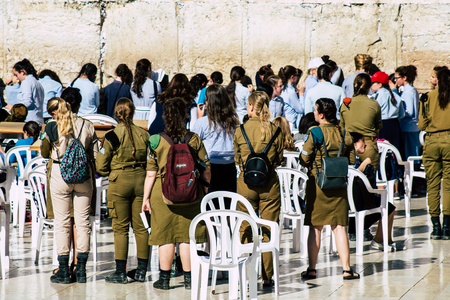 Jerusalem Israel June 19, 2019 View of young Israeli woman soldier having fun front the Western wall at the Old city of Jerusalem in the afternoonのeditorial素材