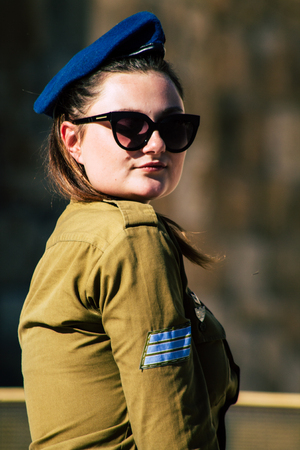 Jerusalem Israel June 19, 2019 View of young Israeli woman soldier having fun front the Western wall at the Old city of Jerusalem in the afternoonのeditorial素材
