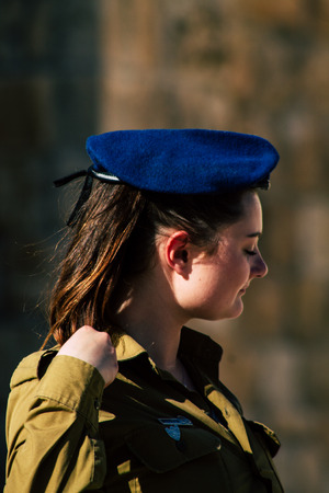 Jerusalem Israel June 19, 2019 View of young Israeli woman soldier having fun front the Western wall at the Old city of Jerusalem in the afternoonのeditorial素材