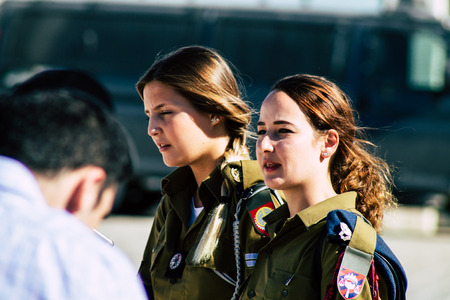 Jerusalem Israel June 19, 2019 View of young Israeli woman soldier having fun front the Western wall at the Old city of Jerusalem in the afternoonのeditorial素材