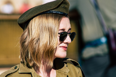 Jerusalem Israel June 19, 2019 View of young Israeli woman soldier having fun front the Western wall at the Old city of Jerusalem in the afternoonのeditorial素材