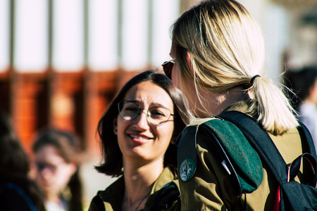 Jerusalem Israel June 19, 2019 View of young Israeli woman soldier having fun front the Western wall at the Old city of Jerusalem in the afternoonのeditorial素材