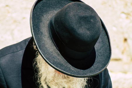 Jerusalem Israel June 19, 2019 View of unknown orthodox Israeli man praying at the Western wall in the Old city of Jerusalem in the afternoonのeditorial素材