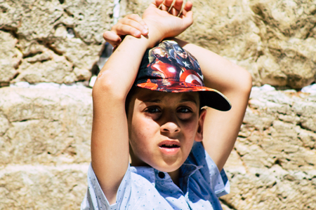 Jerusalem Israel June 19, 2019 View of young Israeli kid praying at the Western wall in the Old city...