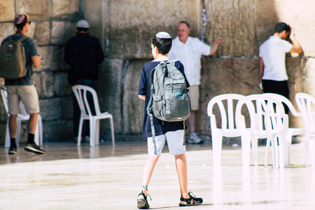 Jerusalem Israel June 19, 2019 View of young Israeli kid praying at the Western wall in the Old city of Jerusalem in the afternoonのeditorial素材