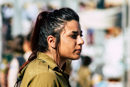 Jerusalem Israel June 19, 2019 View of young Israeli woman soldier having fun front the Western wall at the Old city of Jerusalem in the afternoonのeditorial素材