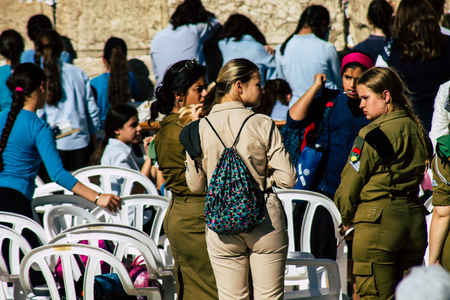 Jerusalem Israel June 19, 2019 View of young Israeli woman soldier having fun front the Western wall at the Old city of Jerusalem in the afternoonのeditorial素材