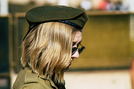 Jerusalem Israel June 19, 2019 View of young Israeli woman soldier having fun front the Western wall at the Old city of Jerusalem in the afternoonのeditorial素材