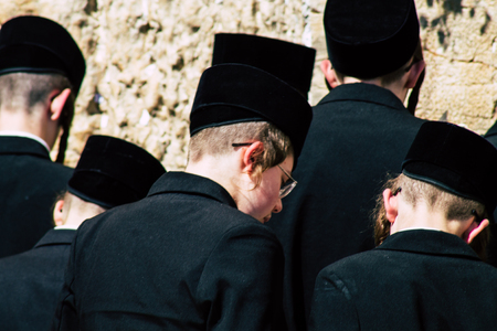 Jerusalem Israel June 19, 2019 View of unknown orthodox Israeli man praying at the Western wall in the Old city of Jerusalem in the afternoonのeditorial素材