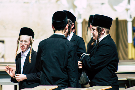 Jerusalem Israel June 19, 2019 View of unknown orthodox Israeli man praying at the Western wall in the Old city of Jerusalem in the afternoonのeditorial素材