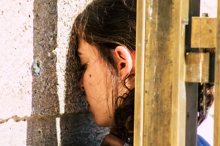 Jerusalem Israel June 19, 2019 View of unknown Israeli woman praying at the Western wall in the Old city of Jerusalem in the afternoonのeditorial素材