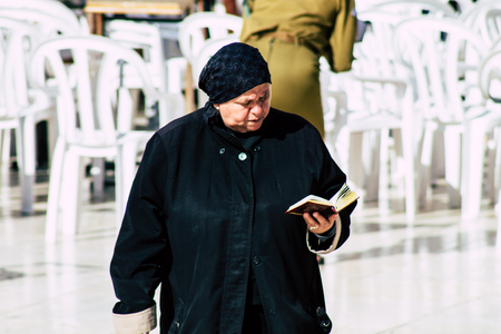 Jerusalem Israel June 19, 2019 View of unknown Israeli woman praying at the Western wall in the Old city of Jerusalem in the afternoonのeditorial素材