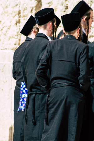 Jerusalem Israel June 19, 2019 View of unknown orthodox Israeli man praying at the Western wall in the Old city of Jerusalem in the afternoonのeditorial素材